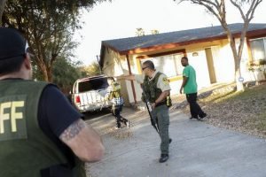 Law enforcement officers search for the suspects of a mass shooting December 2, 2015 in San Bernardino, California. A man and a woman suspected of carrying out a deadly shooting at a center for the disabled were killed in a shootout with police, while a third person was detained, police said. AFP PHOTO / PATRICK T. FALLON / AFP / Patrick T. Fallon