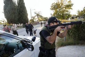 Law enforcement officers search for the suspects of a mass shooting December 2, 2015 in San Bernardino, California. A man and a woman suspected of carrying out a deadly shooting at a center for the disabled were killed in a shootout with police, while a third person was detained, police said. AFP PHOTO / PATRICK T. FALLON / AFP / Patrick T. Fallon
