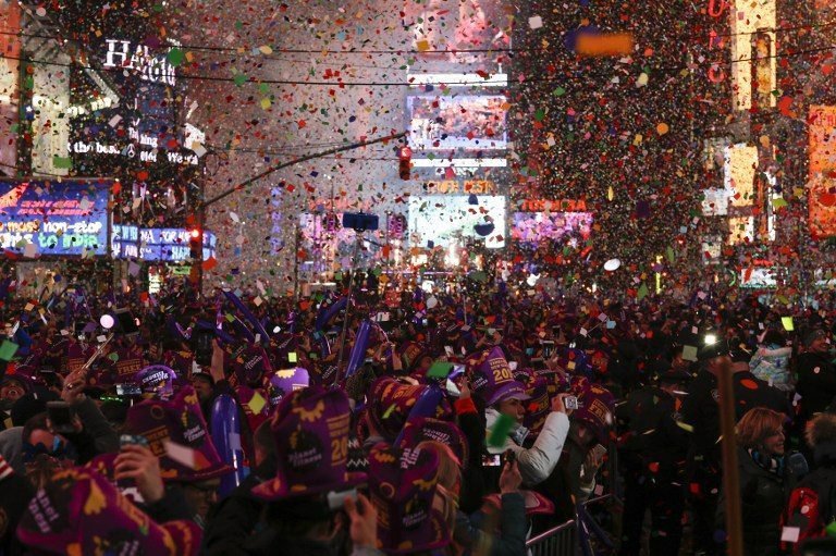 NEW YORK, NY - JANUARY 1: People take part in celebrations at Times Square on January 1, 2016 in New York City. At least 6,000 police officers were deployed, including rooftop snipers, canine units and air and water patrols, in and around Times Square in Manhattan. Mayor Bill de Blasio declared New York to be "the best prepared city to prevent terrorism and to deal with any event that could occur." Eduardo Munoz Alvarez