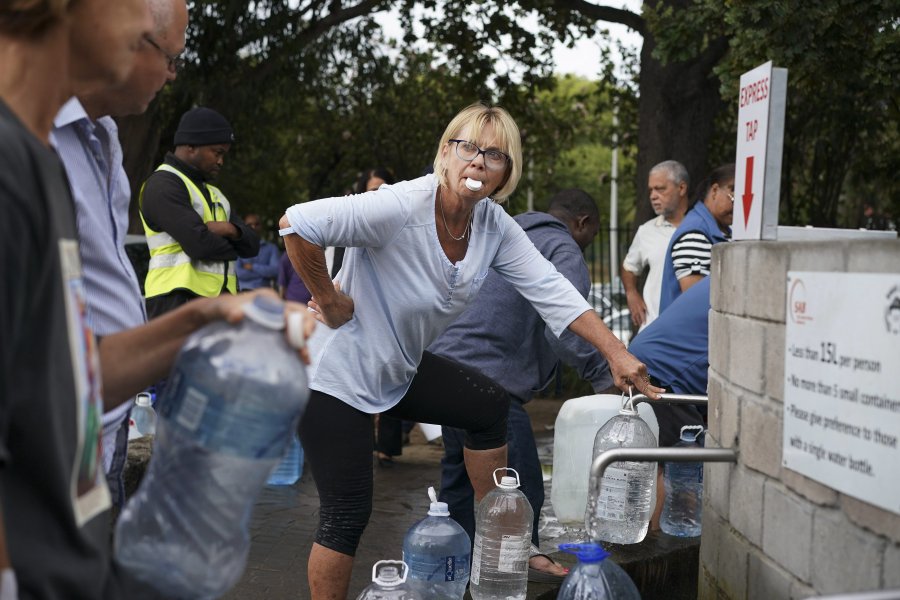 Residents collect water from a spring in the Newlands area of Cape Town