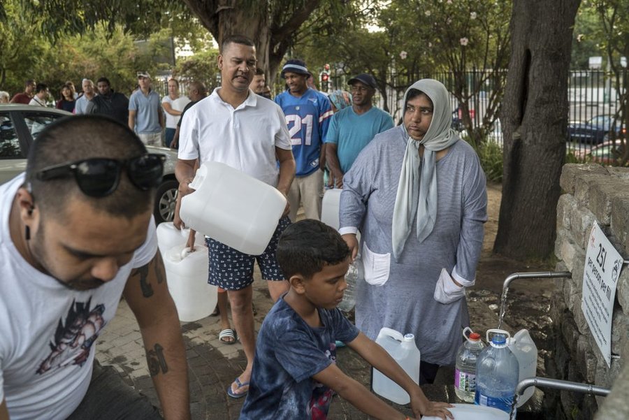 Residents collect water from a spring in the Newlands area of Cape Town